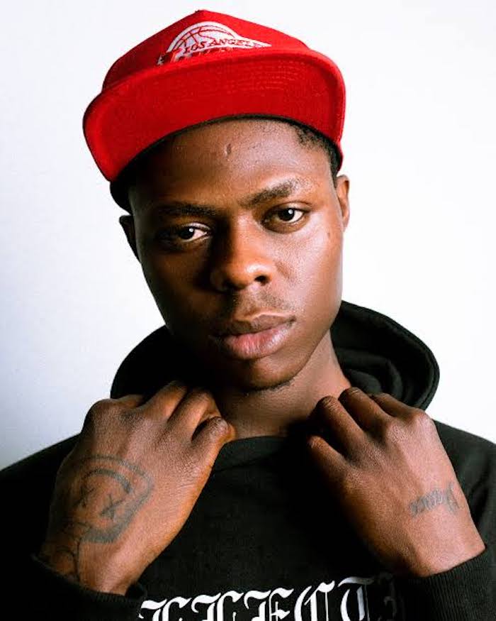 Who Is Mohbad: Nigerian Rapper’s Death Causes Online Outrage With ‘Justice For Mohbad’ 1 The rapper died last Tuesday at the young age of 27, which resulted in outrage from his fans who took to social media and to the streets as well, demanding a thorough investigation into the death of the acclaimed musician. The rapper died last Tuesday at the young age of 27, which resulted in outrage from his fans who took to social media and to the streets as well, demanding a thorough investigation into the death of the acclaimed musician. mohbad 1