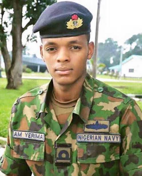 Lieutenant Yarima Saga and What It Tells Us About Power in Nigeria 1 Lieutenant Yarima is not a civilian operative wandering outside his jurisdiction, he’s a commissioned naval officer. According to fact-checkers, his deployment is lawful: his assignment to a retired naval chief is legitimate, and there is no conclusive connection between him and high-ranking retired generals beyond a coincidental surname. But in Nigeria, uniformed officers are often caught in the crossfire of political authority, especially where land and influence intersect. The fact that military veterans are openly threatening to “occupy” the office and residence of a sitting minister if he dares penalize Yarima underscores just how fraught these relationships can be. Lieutenant Yarima is not a civilian operative wandering outside his jurisdiction, he’s a commissioned naval officer. According to fact-checkers, his deployment is lawful: his assignment to a retired naval chief is legitimate, and there is no conclusive connection between him and high-ranking retired generals beyond a coincidental surname. But in Nigeria, uniformed officers are often caught in the crossfire of political authority, especially where land and influence intersect. The fact that military veterans are openly threatening to “occupy” the office and residence of a sitting minister if he dares penalize Yarima underscores just how fraught these relationships can be. 8e5ef9198e9c41cab58fba4ec475d481